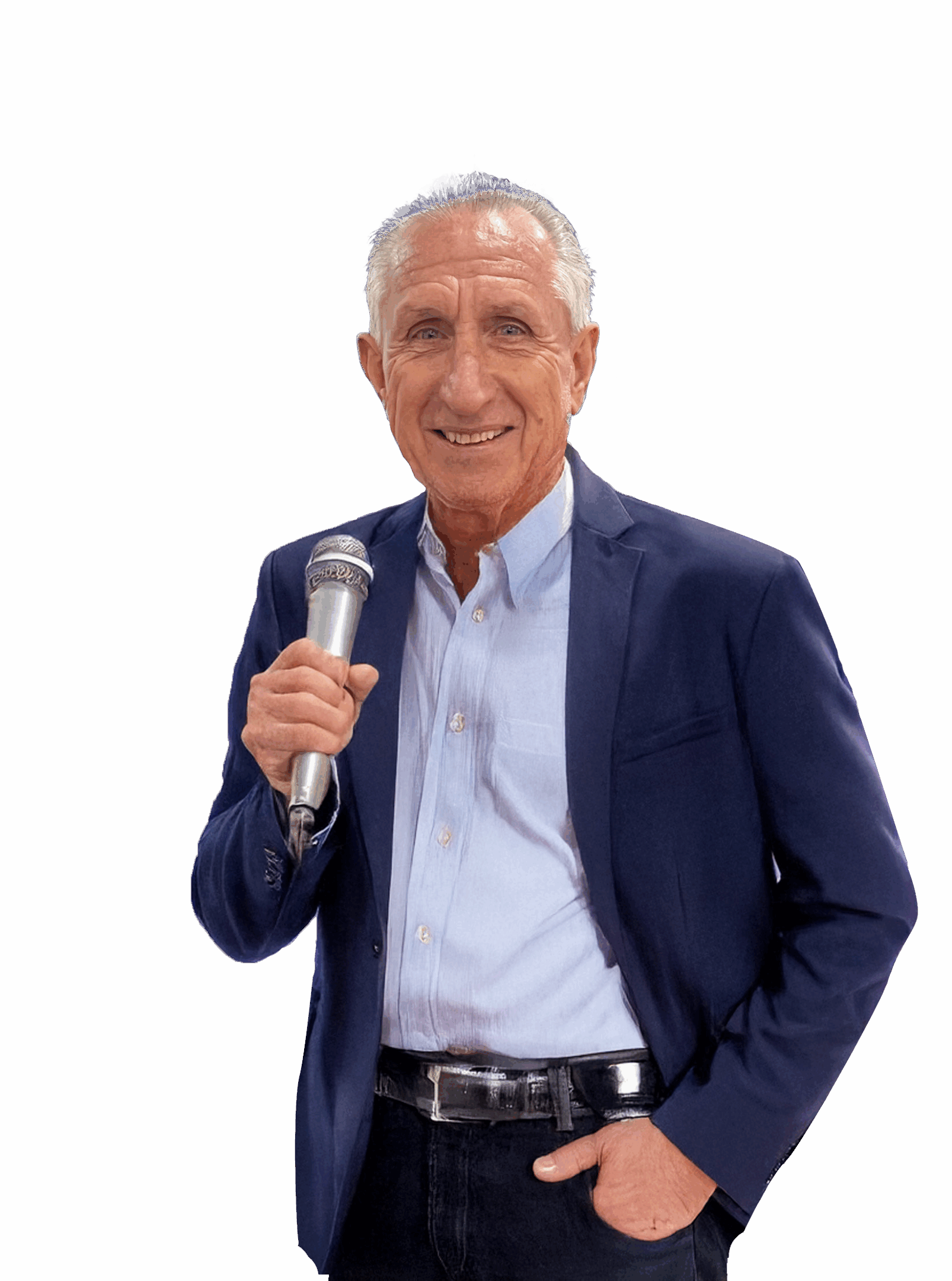 Man holding microphone, wearing suit, smiling confidently.