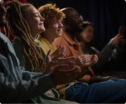 Audience applauding during a live performance.